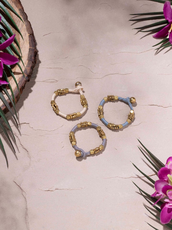 Side view of Dhokra bracelet set highlighting intricate patterns and craftsmanship.