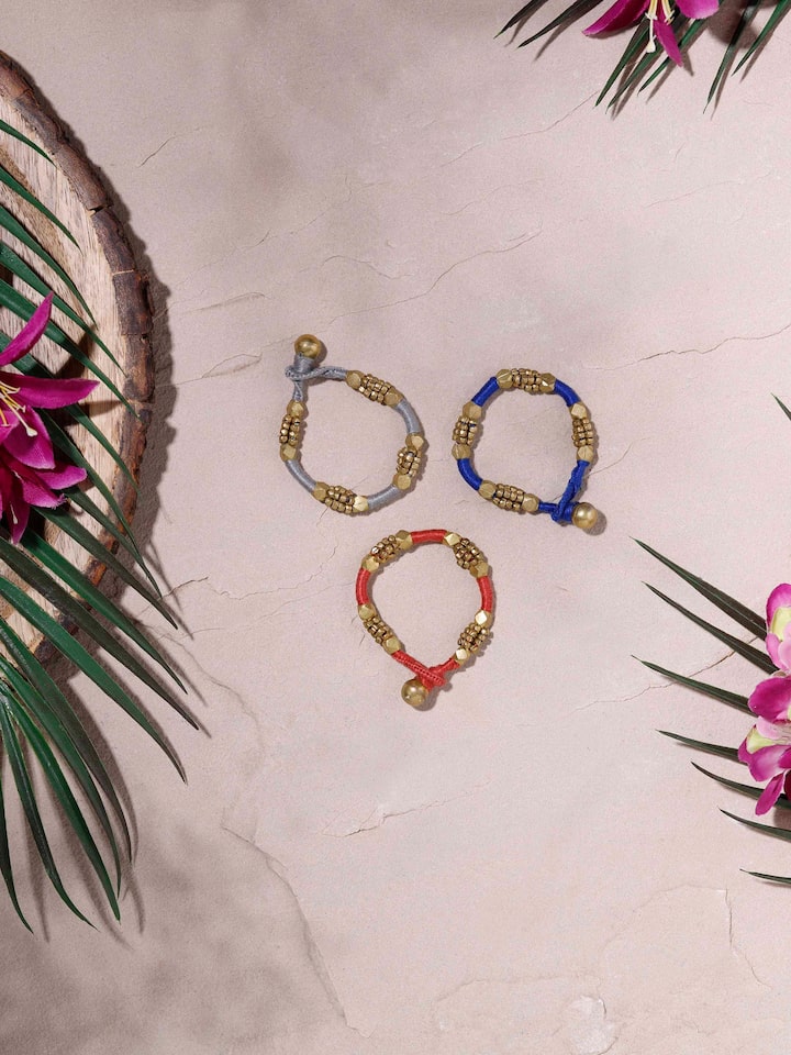 Close-up view of Dhokra Bracelet Set (3 pcs) showcasing detailed engravings and artistic design