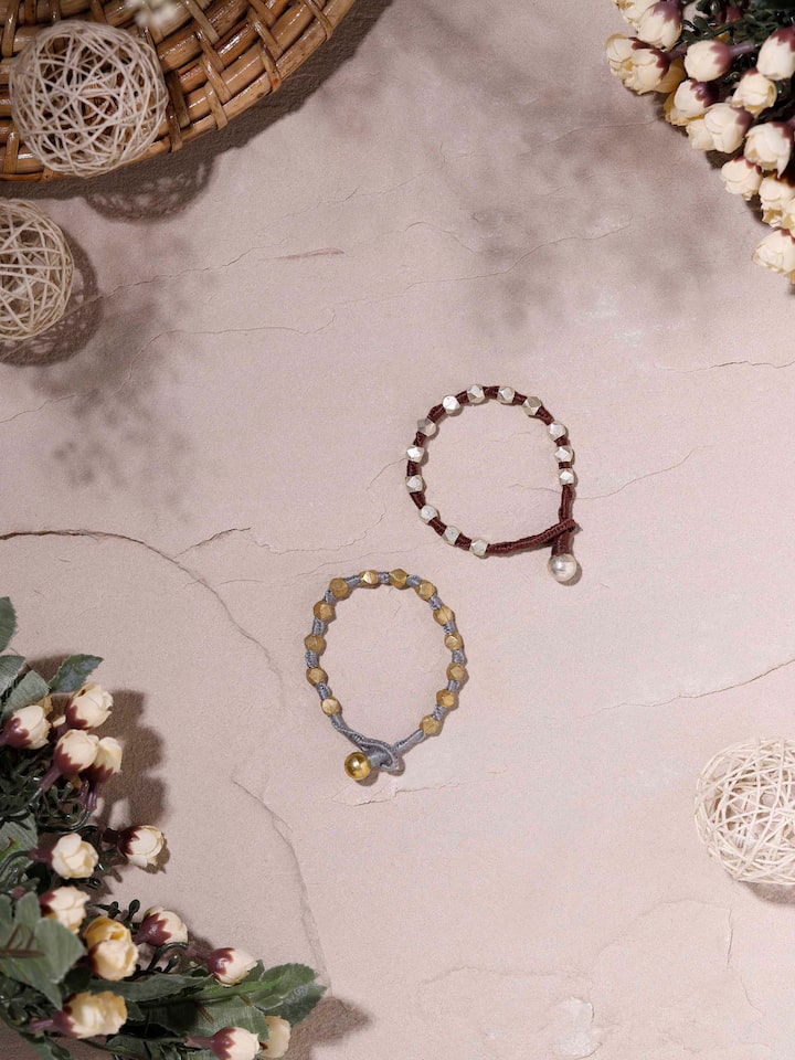 Angled view of Dhokra Bracelet Set showcasing traditional Dhokra patterns and craftsmanship.