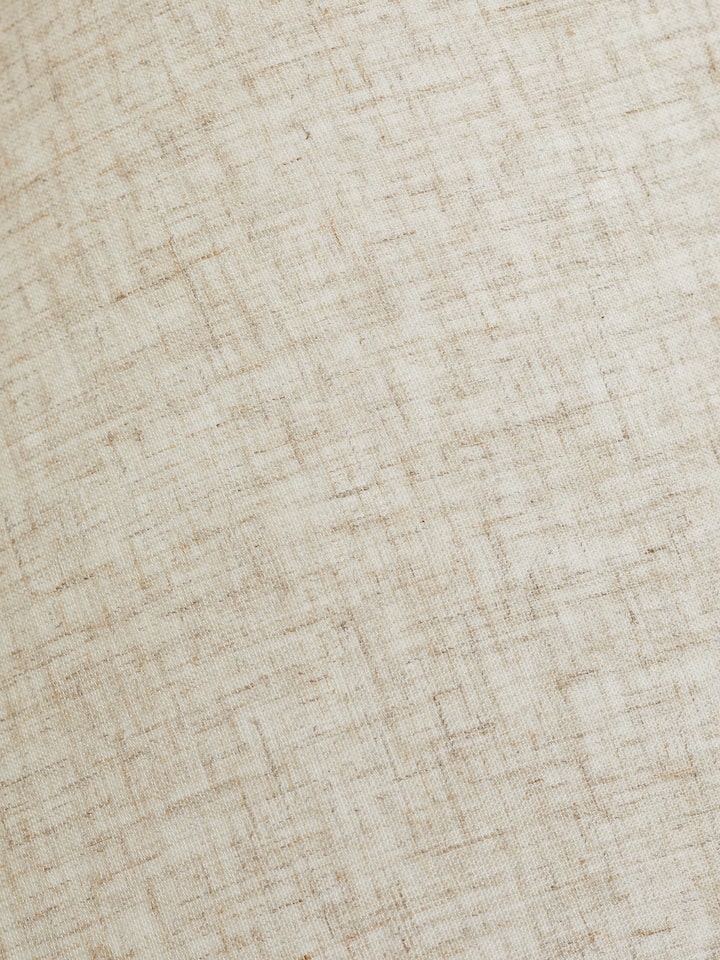 Top view of the off-white studio pottery & cotton table lamp, showing the lamp shade and light fixture.