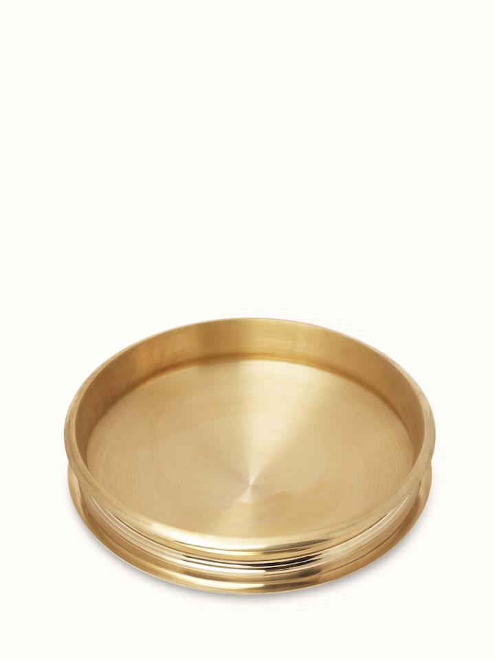 Side view of Traditional brass urli showcasing its elegant shape and detailed craftsmanship.