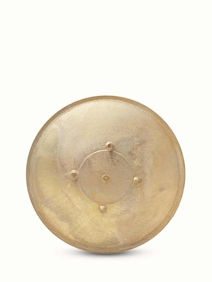 Detailed view of Traditional brass urli showcasing its ornate design and high-quality brass.