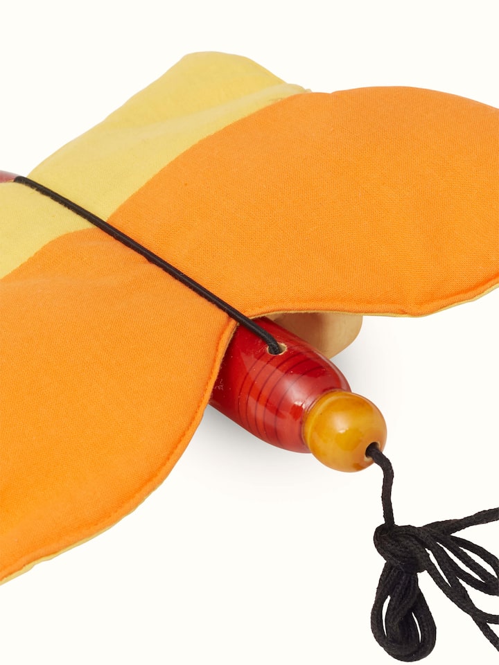 Zoom front view of Channapatna Wooden Thithli Toy displaying its playful design and artisanal quality