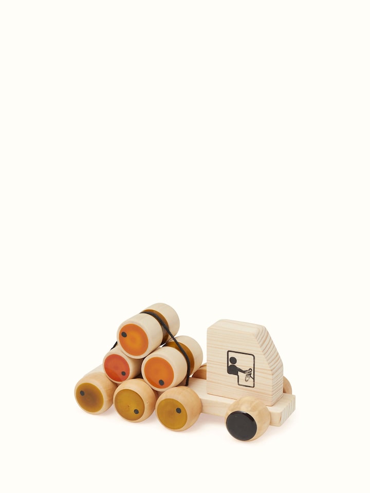 Close-up view of Channapatna Wooden Rumbelorry Toy focusing on intricate wooden details and craftsmanship.