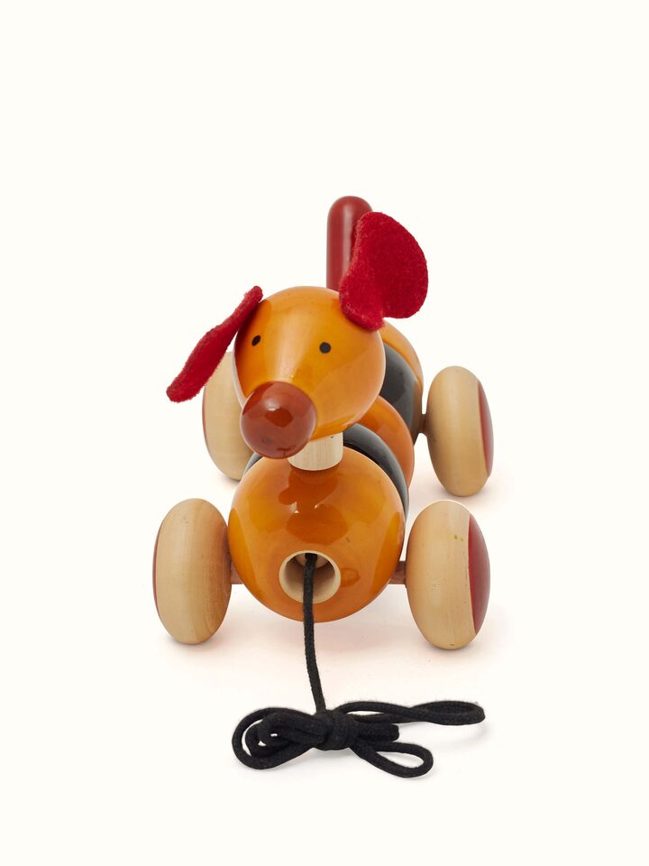 Side view of Channapatna Wooden Bovow Toy highlighting its wooden texture and shape.