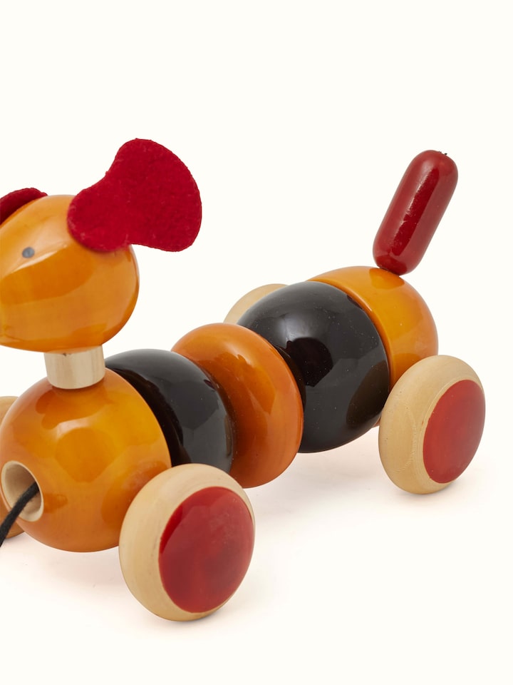 Detail view of Channapatna Wooden Bovow Toy focusing on its intricate wooden craftsmanship and finish.