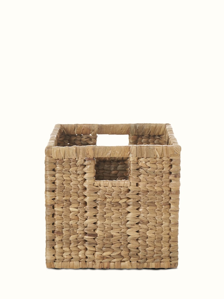 Front view of traditional natural water hyacinth fibre storage organiser, highlighting the woven texture and design.
