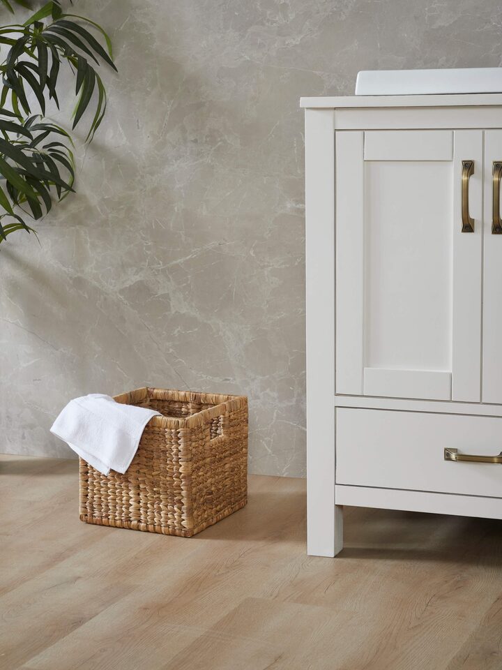 Side view of traditional natural water hyacinth fibre storage organiser, showcasing the natural fiber weave and shape.