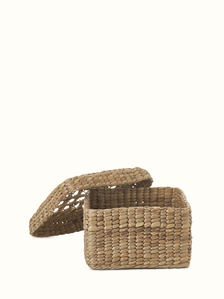 Close-up view of natural water hyacinth fibre storage basket, focusing on the material and texture.