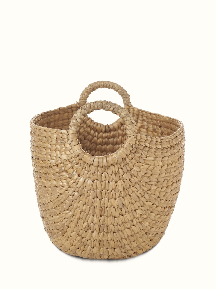 Angled view of Matte natural water hyacinth fibre storage organiser displaying its practical design and natural finish.