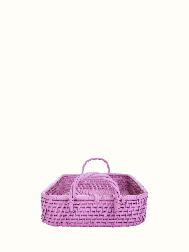 Angled view of cane storage organiser in pink color, showcasing its design and functionality with a focus on the cane weaving