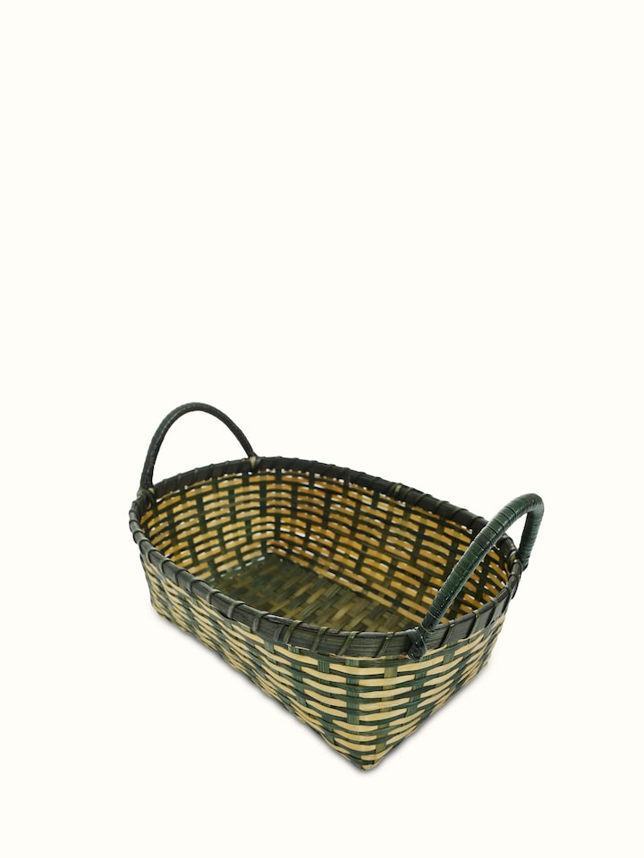 Artistic view of bamboo storage organiser in green, highlighting the design.