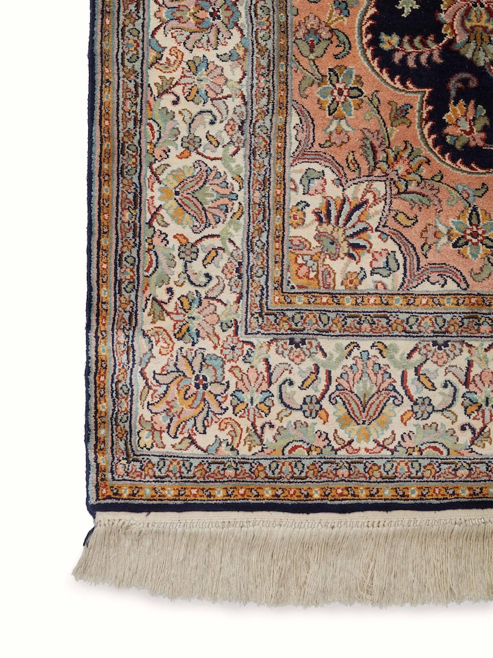 Angled view of Traditional Persian Navy Rust Kashan Kashmir Silk Hand-Knotted Carpet displaying overall design