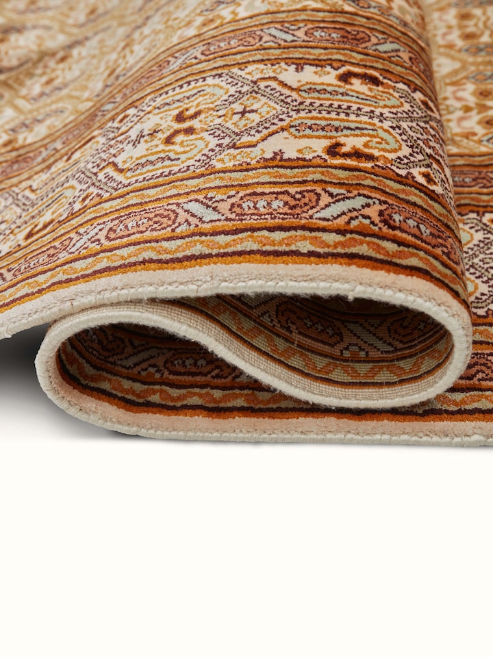 Close-up of Traditional Persian Ivory Senna Kashmir Silk Hand-Knotted Carpet displaying the rich color palette and meticulous knotting
