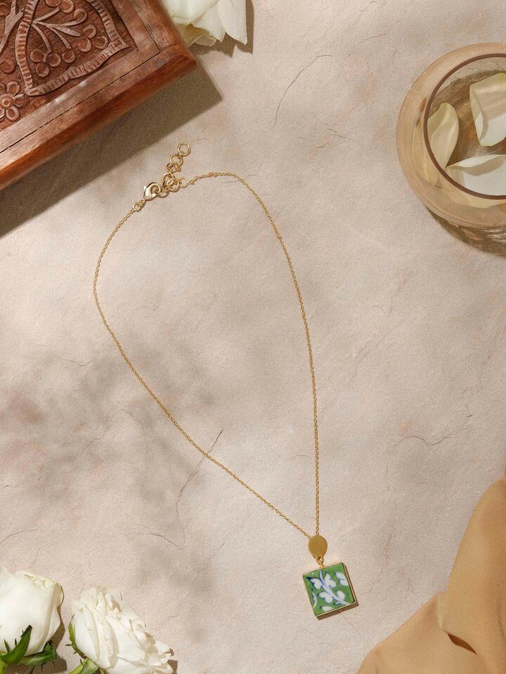 Side view of Blue Pottery Pendant & Chain showing the pendant's artistic design and chain length