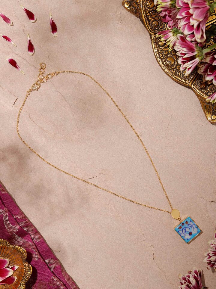 Side view of Blue Pottery Pendant & Chain showcasing the detailed pottery work and sleek chain design