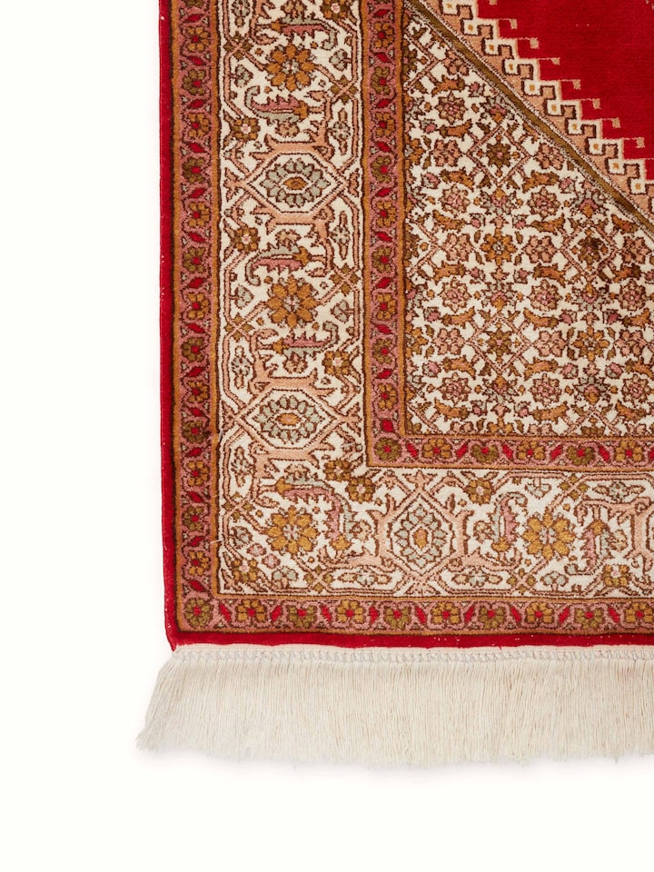 Side view of Traditional Persian Red Senneh Kashmir Silk Hand-Knotted Carpet emphasizing the texture and design depth.
