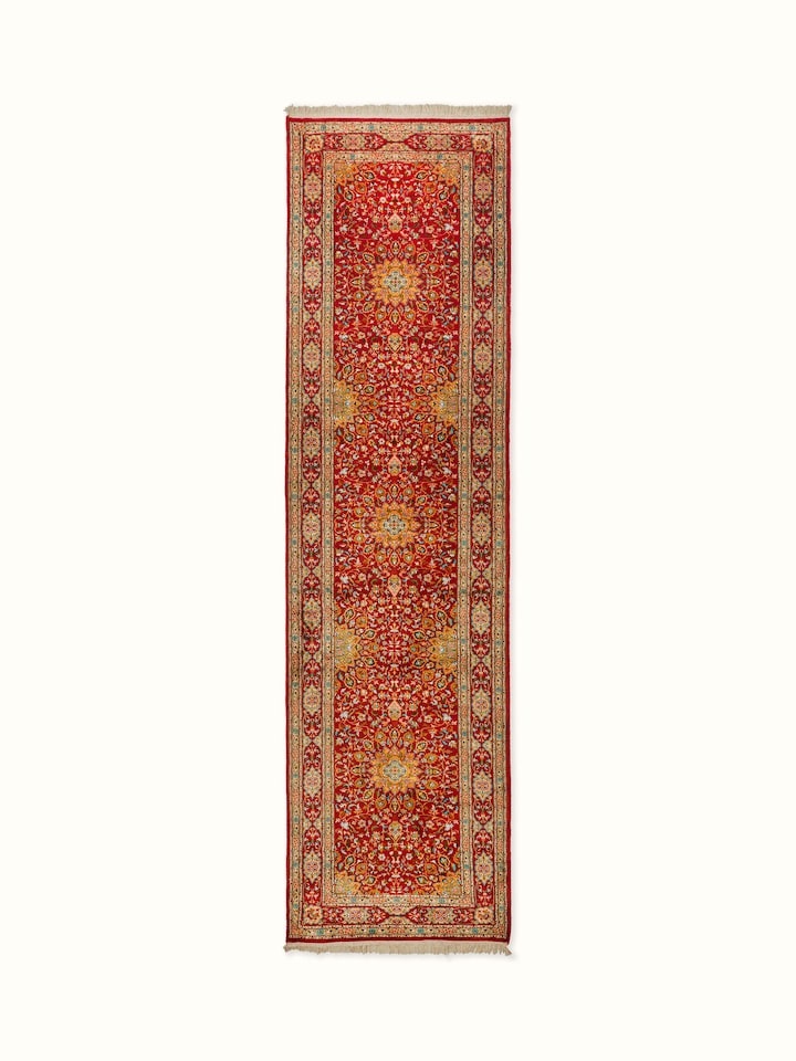 Traditional Persian red Kashan Kashmir silk hand-knotted runner with intricate patterns and rich red hues.