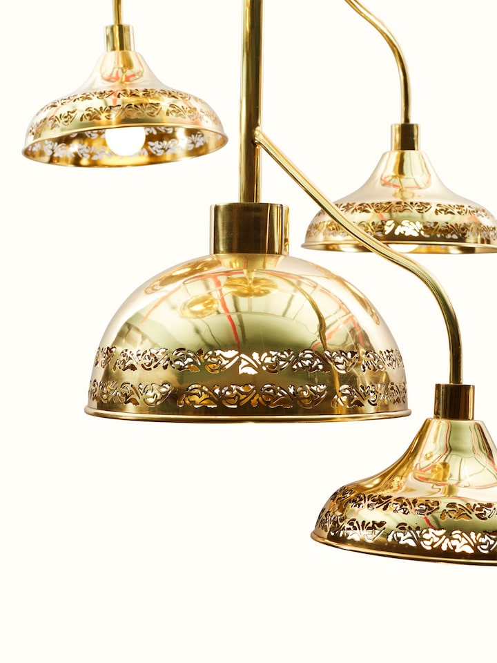 Detail view of Brass Nakkashi Cluster Light focusing on the intricate brasswork and design elements.