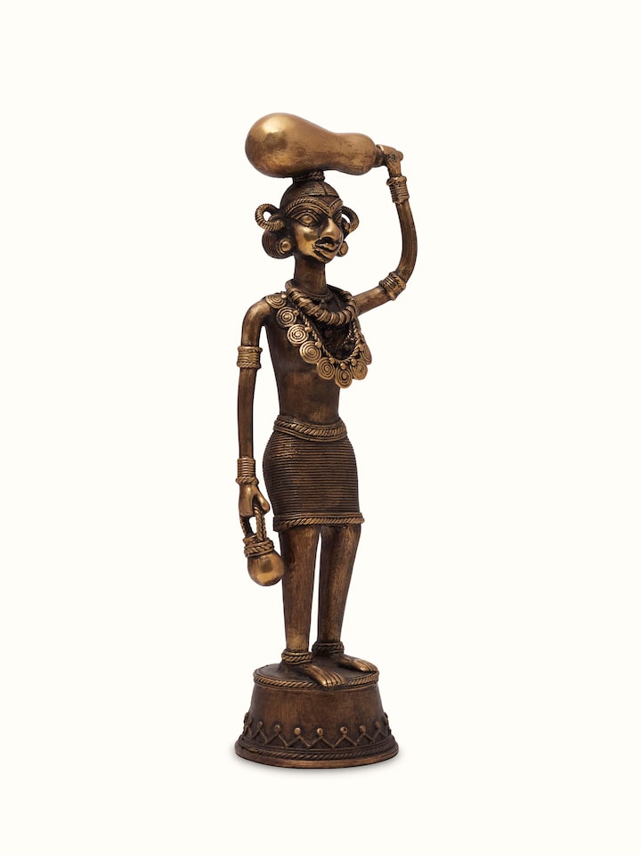 Side view of Dhokra Brass Tribal Woman Figurine, highlighting the detailed brasswork and graceful figure of the tribal woman.