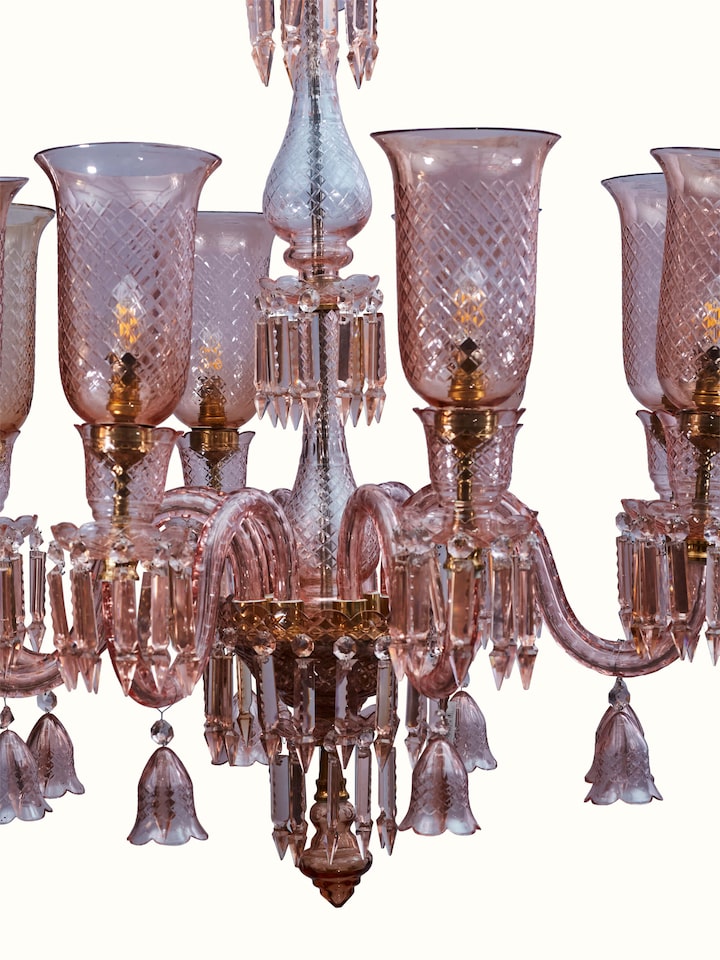 Close-up of Pink Glass Chandelier focusing on the details of the pink glass and metal fittings.