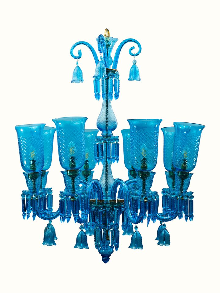 Angled view of Blue Glass Chandelier displaying its elegant design and vivid blue color.