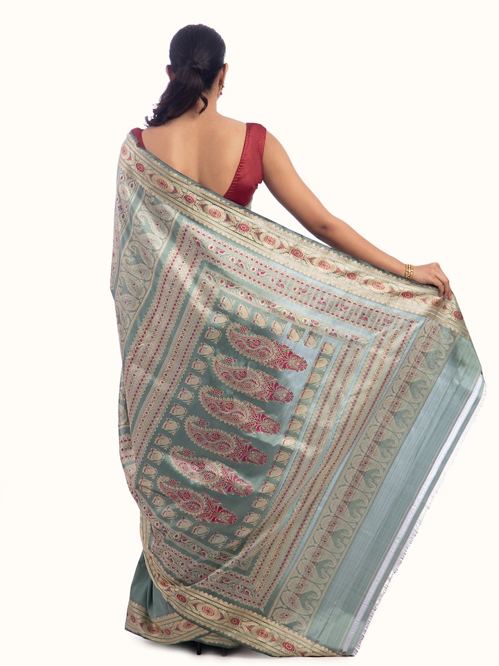 Close-up view of Sage green mulberry silk Baluchari saree with detailed patterns