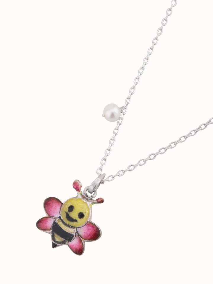 Overhead shot displaying the pendant’s shape and delicate meenakari artistry