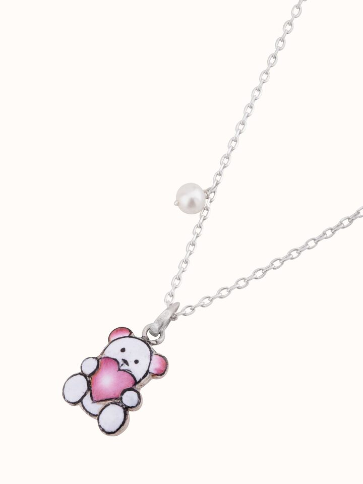 Overhead view displaying elegant curves and vibrant pink enamel on pendant