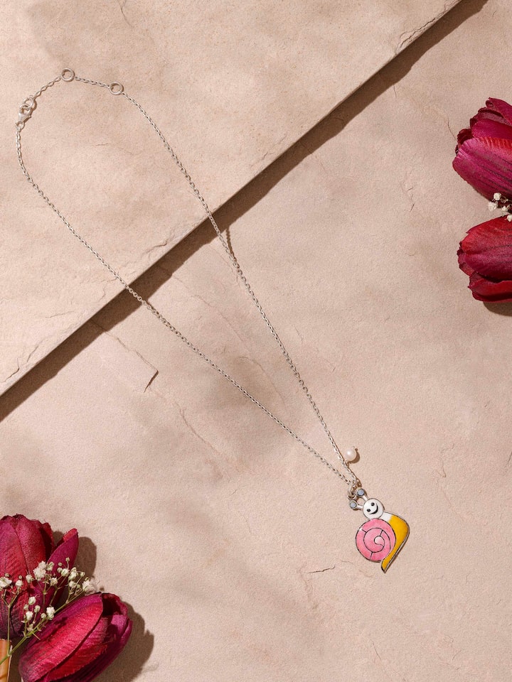 Angled side view focusing on meenakari detailing and chain attachment on pendant