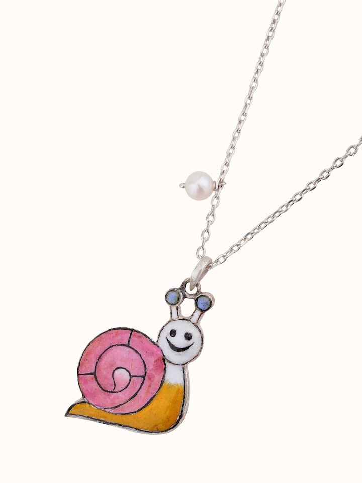 Overhead shot showing the overall design and shape of the meenakari pendant