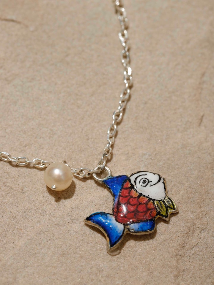Detailed close-up displaying the bracelet’s artistic motifs and flexible silver structure