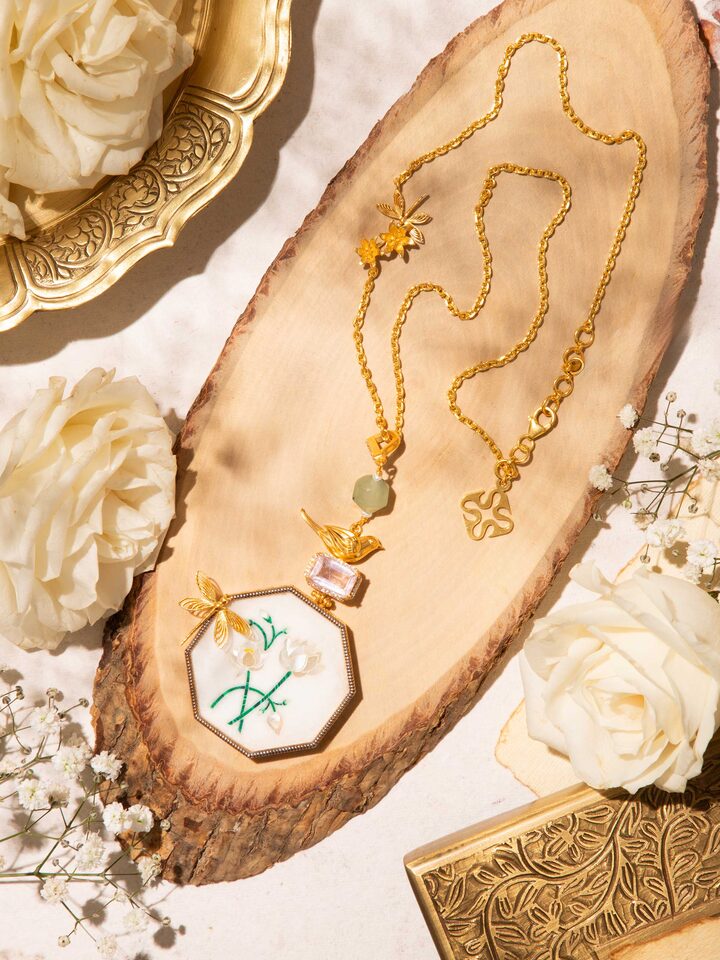 Styled detail view of Parchinkari Silver Pendant & Chain worn around the neck, shown in an alternate styled shot