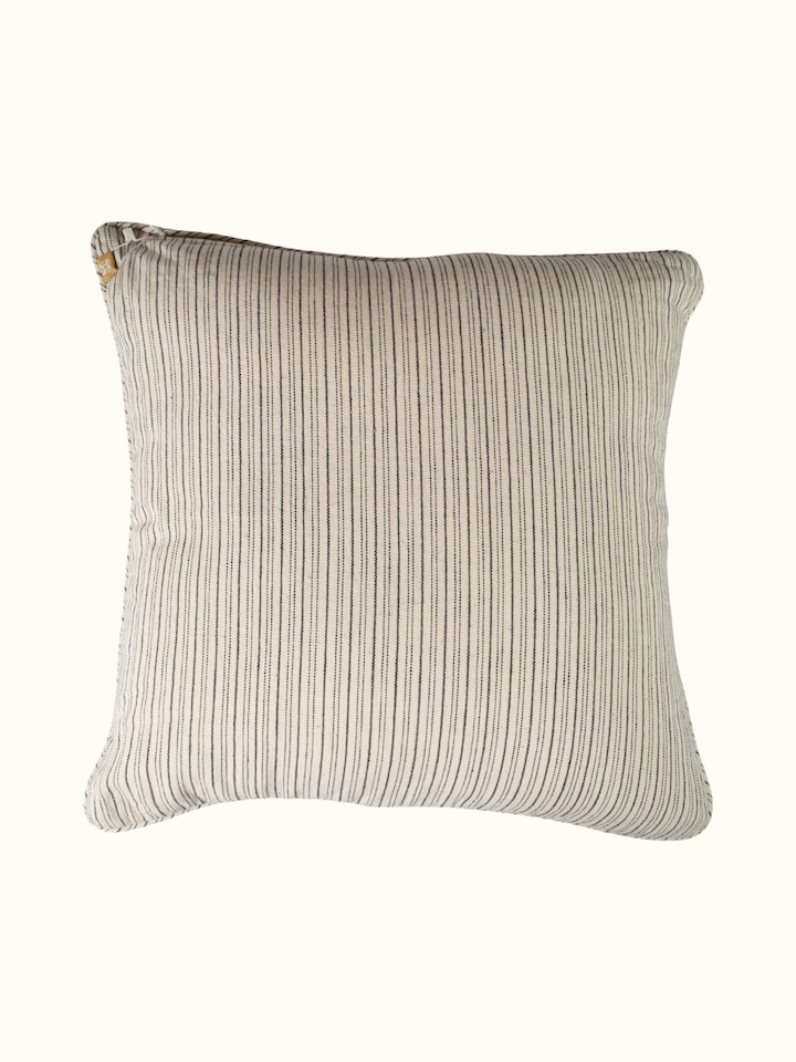 Folk geo hand embroidered bootis cushion cover, back view with fabric texture