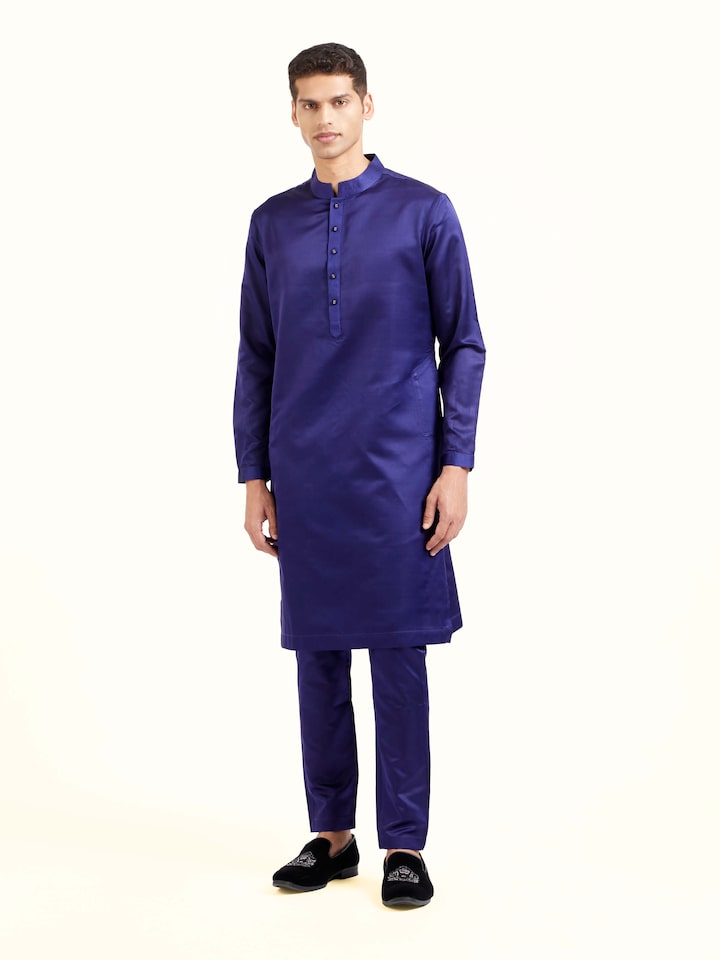 Front view of navy blue katan silk Banarasi midi kurta pant set with woven brocade details