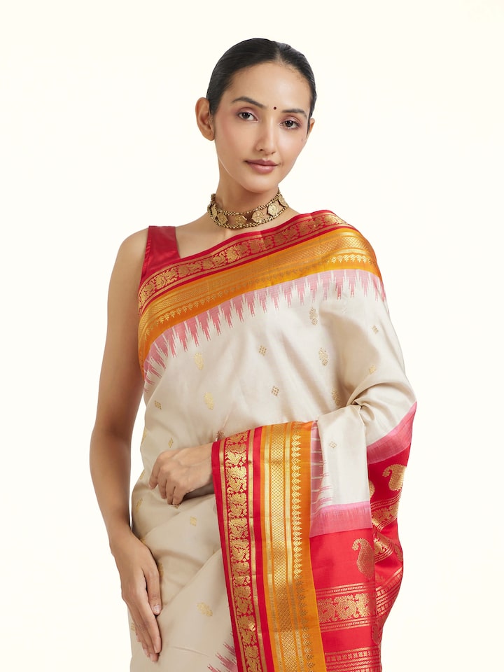 Angled view of Cream Gadwal Silk Zari Saree revealing the depth of its color and intricate pattern