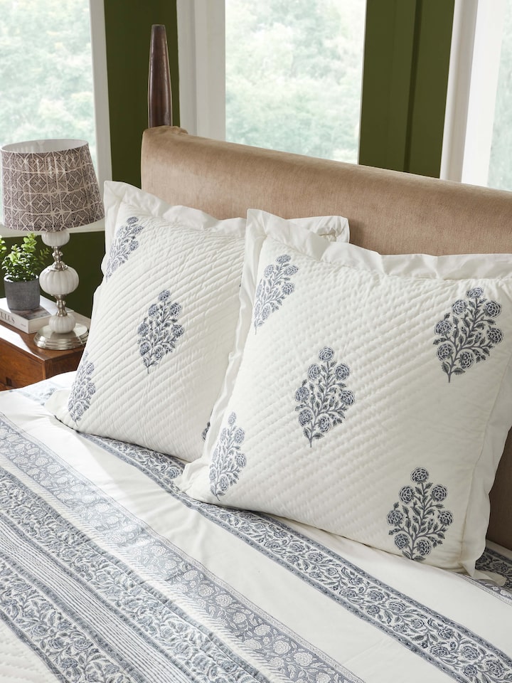 Lifestyle image showing the Saha Grey Buta Stripe Cushion Covers on a sofa setting