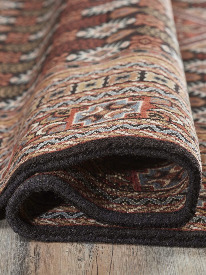 Back view showing the neat hand-knotted work and quality of the wool material