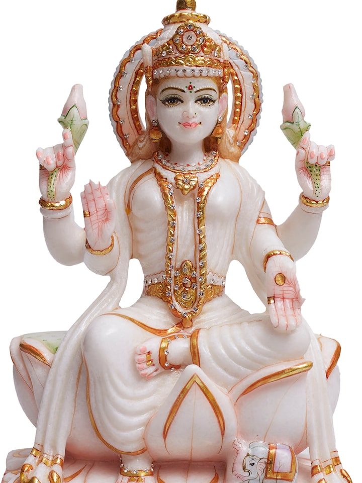 detail view of carved marble lakshmi idol craftsmanship