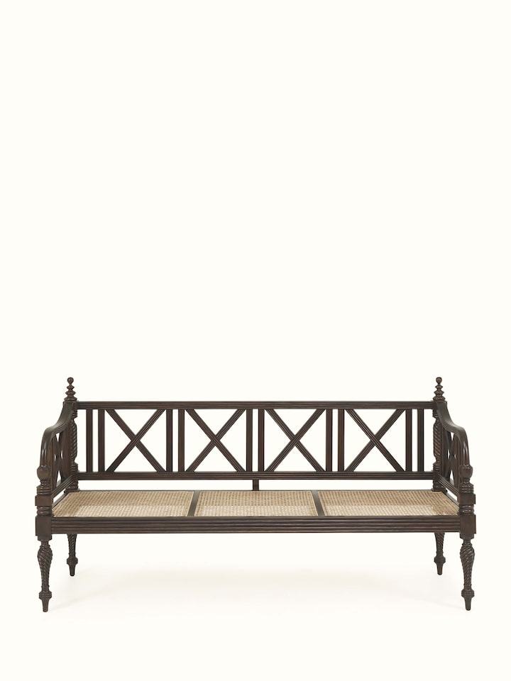 Front view of Walnut finish Mahogany wood and cane 3-seater sofa by Swadesh featuring luxurious cane panels and rich tone