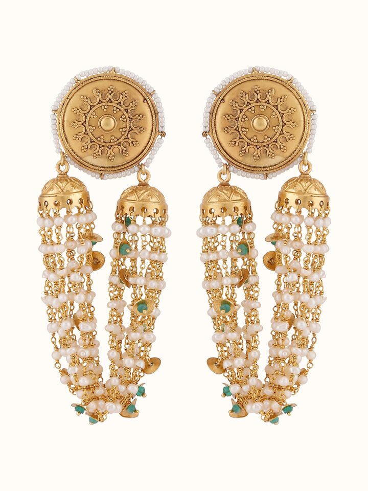 Front view presenting the delicate silver drop earrings with fine details