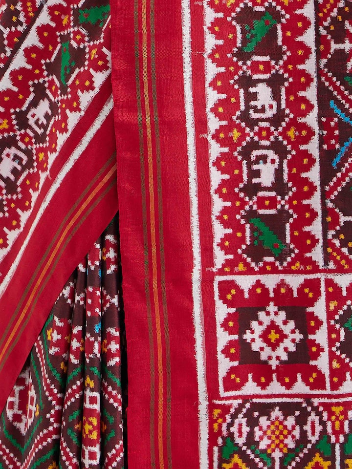 Detail view of brown silk Patola saree showcasing intricate craftsmanship