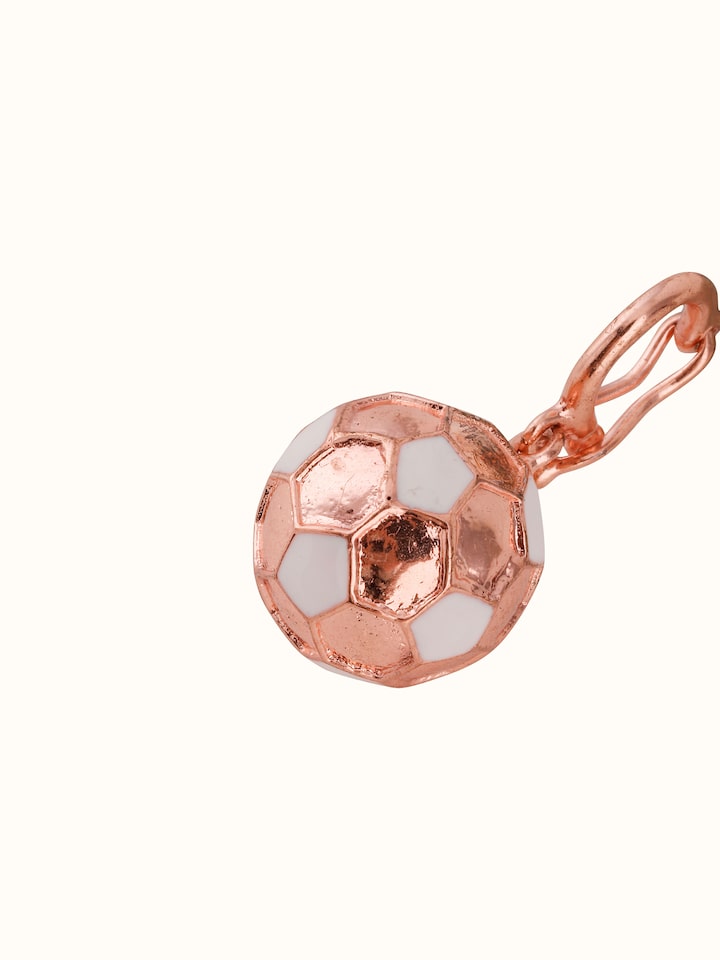 Overhead view of silver pendant emphasizing its symmetrical shape and handcrafted contours