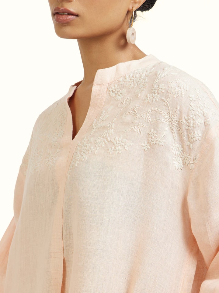 Detail view of Peach Linen Chikankari Tunic highlighting the embroidery and stitch detail