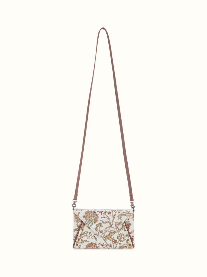 Front view of mustard sling bag with leather and hand block printed textile panel