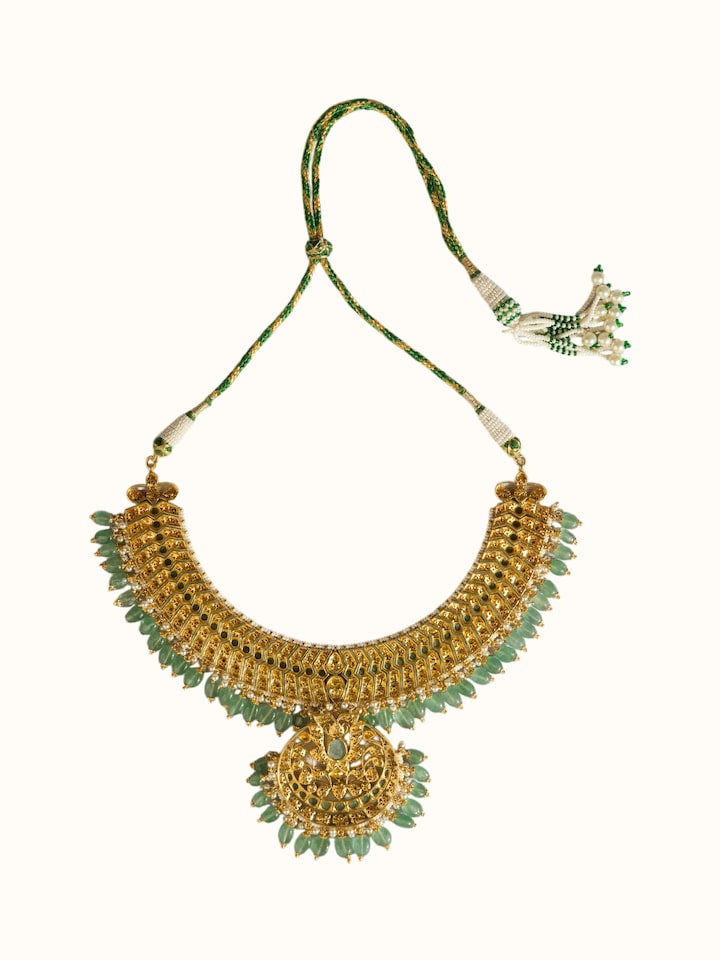 back view of silver smithing gold plated jadau necklace clasp