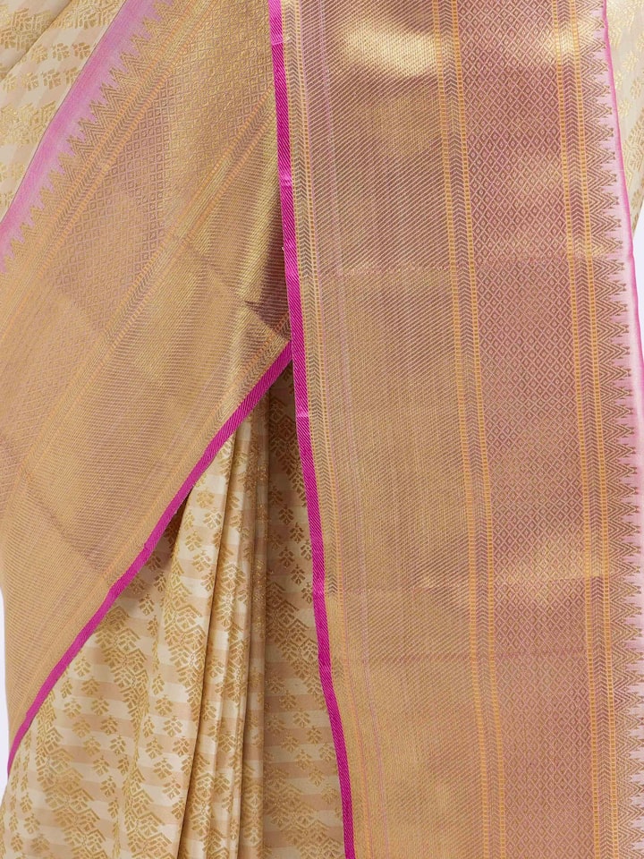 Detail view of off-white silk Kancheepuram saree showing silk texture and weaving details