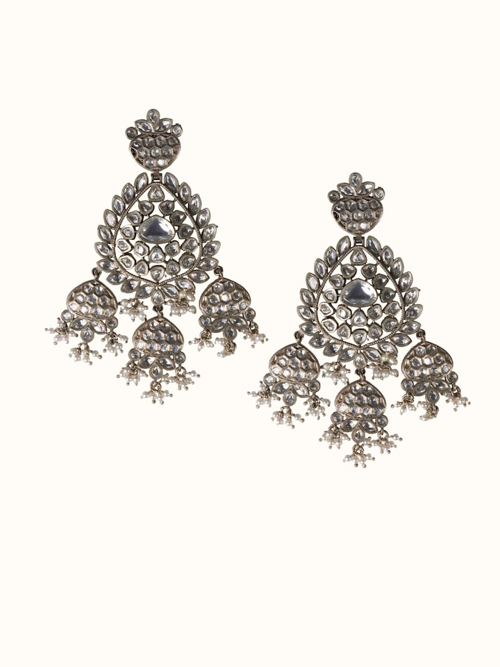 front view of dank polki silver drop earrings with traditional stone setting