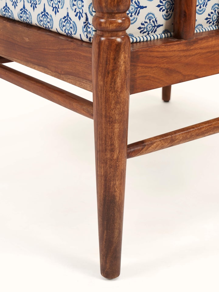 close-up view of upholstered sheesham wood arm chair texture