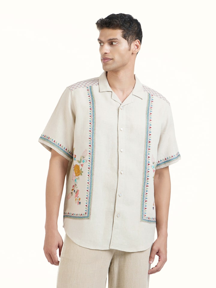 Angled view of Beige Kantha Embroidered Shirt revealing the depth of its color and intricate pattern